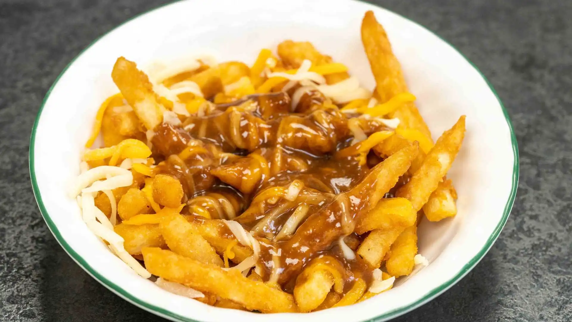 Poutine fries at Ring-a-Wing Oxford Street East London - crispy fries with cheese curds and gravy